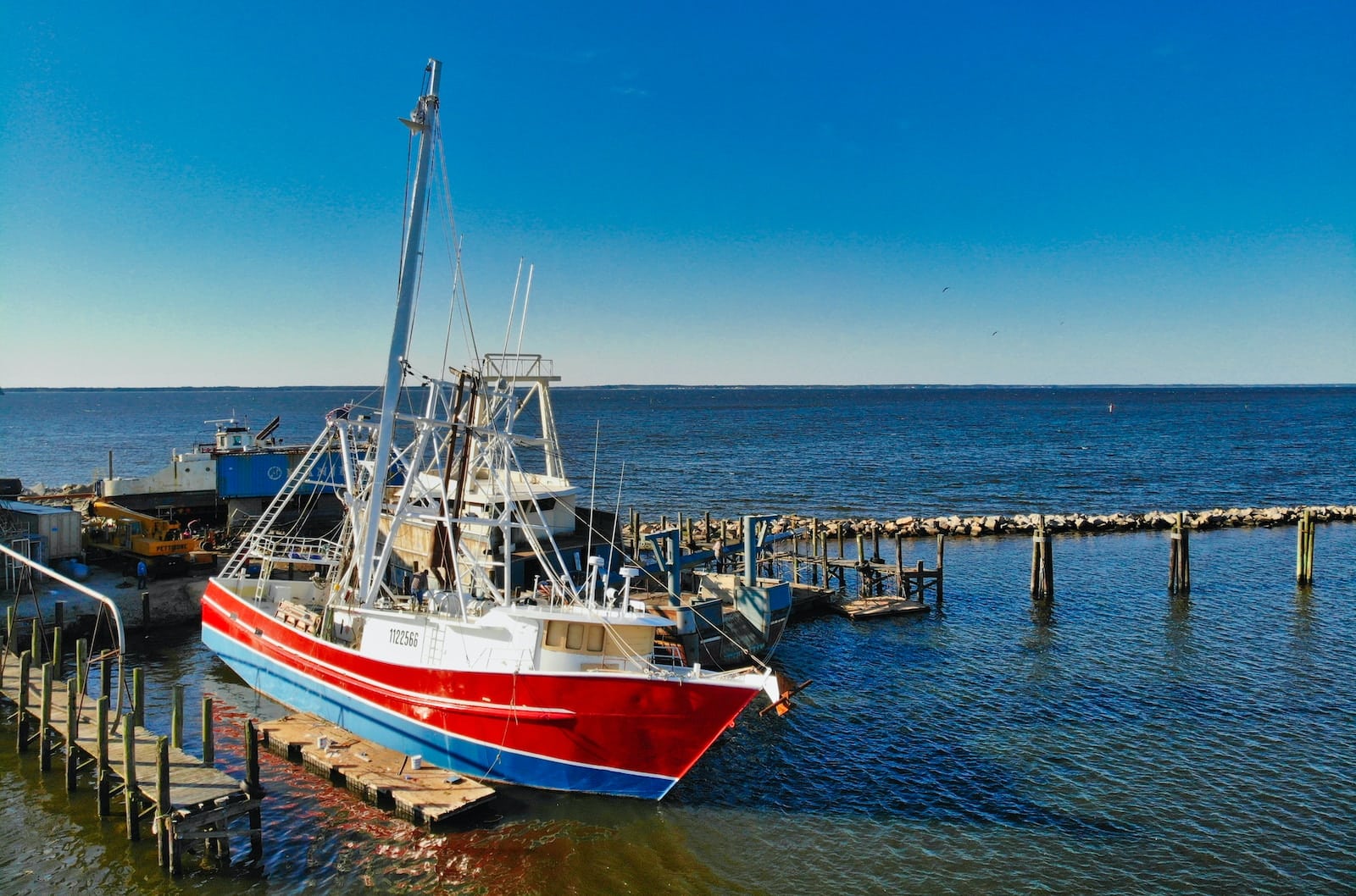 white and blue boat on sea during daytime